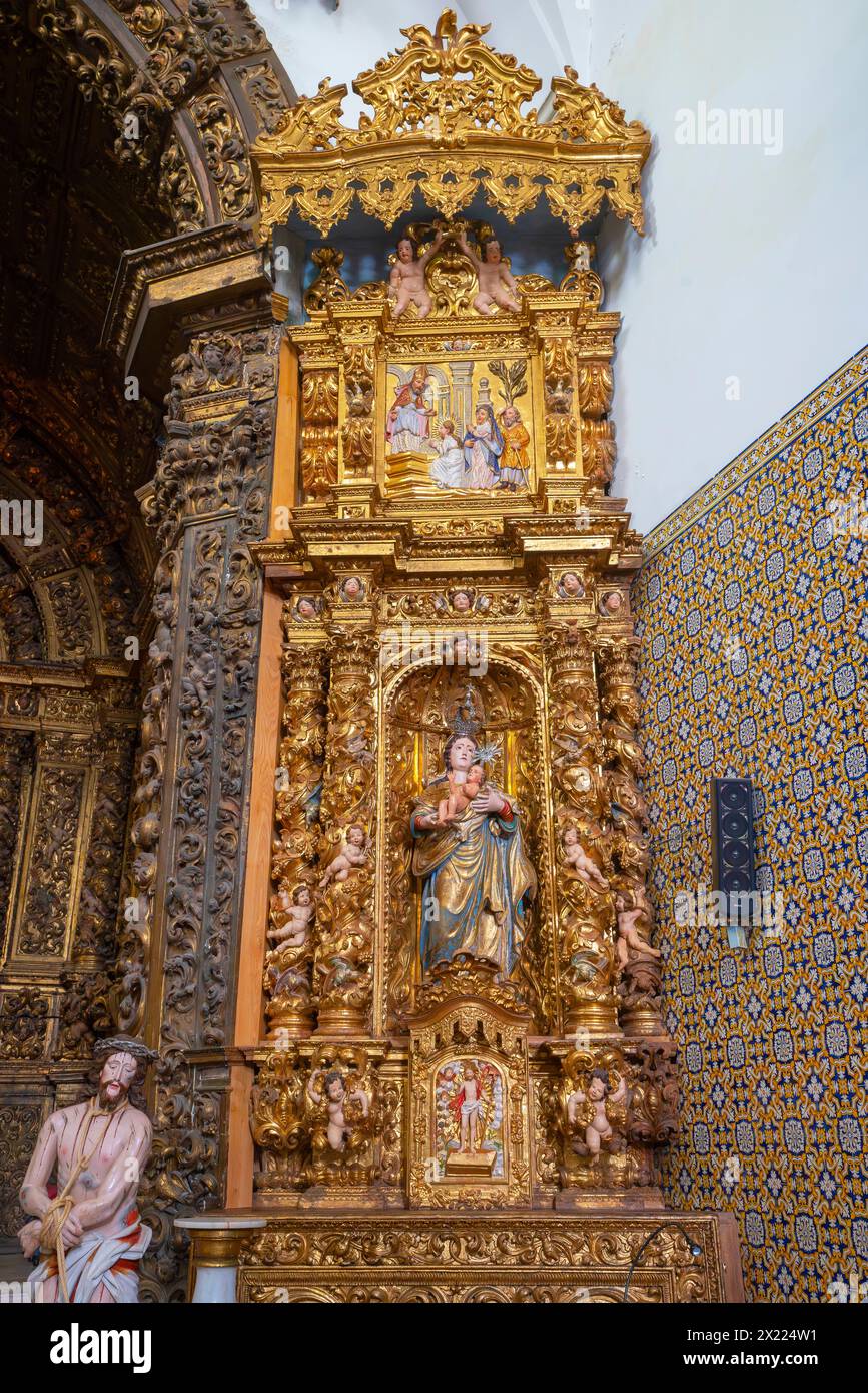 Imressive  gilded altarpiece, Church of Vera Cruz of Aveiro in Portugal. A famous portuguese city known for its river and canals. Aveiro is the capita Stock Photo