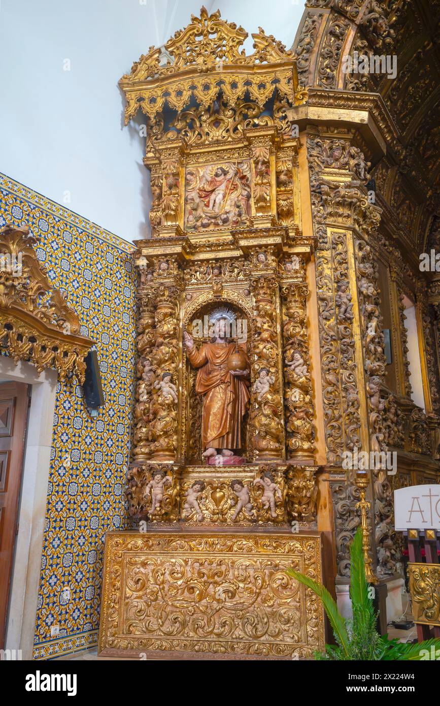 Imressive  gilded altarpiece, Church of Vera Cruz of Aveiro in Portugal. A famous portuguese city known for its river and canals. Aveiro is the capita Stock Photo