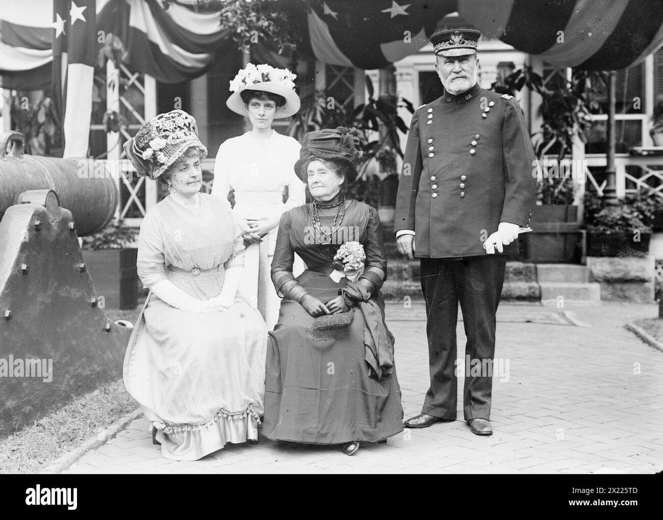 Mrs. F.D. Grant; Mrs. Francis M. Gibson; Mrs. U.S. Grant III; Gen. F.D. Grant, 1911. Shows General Frederick Dent Grant, commanding officer on Governors Island, with his wife (Ida Marie Honorie Grant), Mrs. U.S. Grant III (Edith Root), and Mrs. Francis Marion Gibson. Event is probably the annual lawn party sponsored by the Army Relief Society, which raised money for widows and orphans of officers and enlisted men of the regular army. (Source: Flickr Commons project, 2009) Forms part of: George Grantham Bain Collection (Library of Congress). Title from data provided by the Bain News Service on Stock Photo