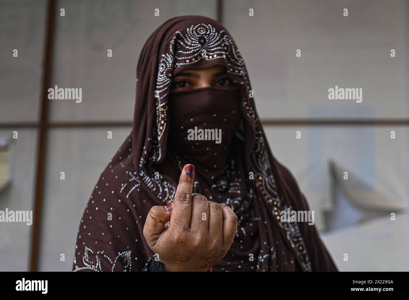 Kairana, Uttar Pradesh, India. 19th Apr, 2024. A women poses for a photograph as she shows her ink-marked finger after voting at a polling station during the first phase of the Indian General Elections at Kairana district, in the Indian State of Uttar Pradesh, India on April 19, 2024. (Credit Image: © Kabir Jhangiani/ZUMA Press Wire) EDITORIAL USAGE ONLY! Not for Commercial USAGE! Stock Photo
