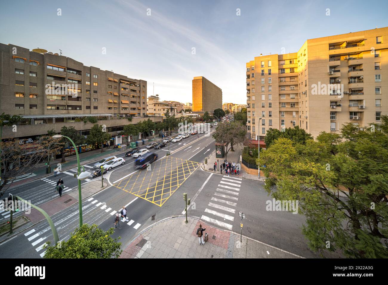 City street in Nervion, Sevilla, Spain, filled with heavy traffic passing by tall modern buildings. Stock Photo