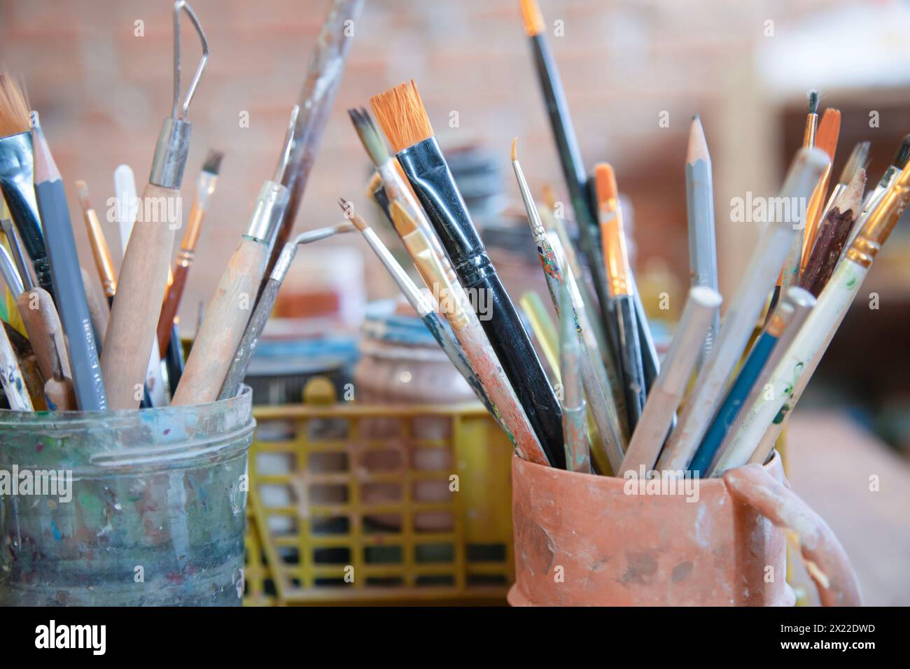 Different brushes in drawing studio interior. Close up view Stock Photo