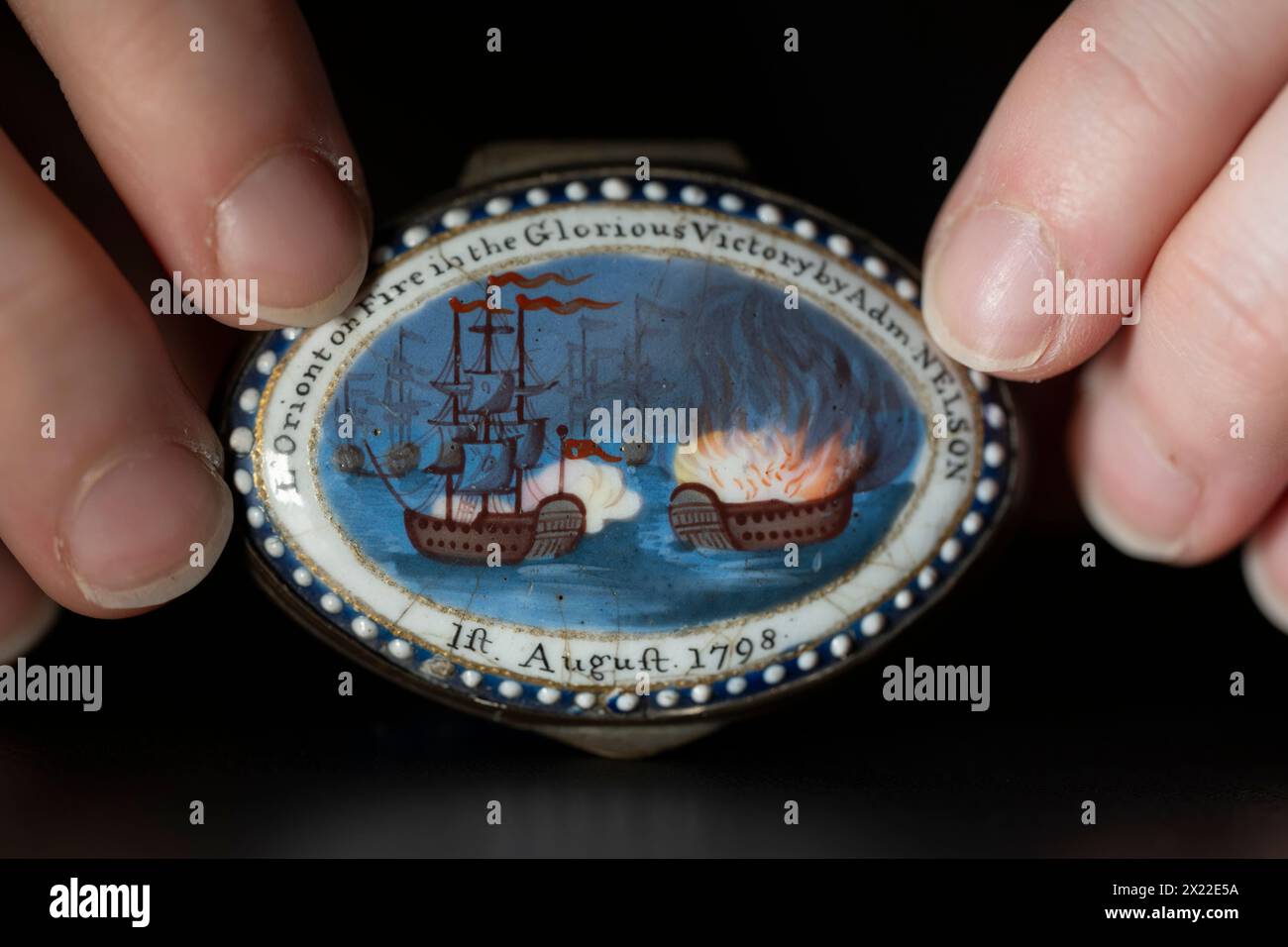 Bonhams, Knightsbridge, London, UK. 19th Apr, 2024. Nelson Forever! A Naval Legacy in Ceramics and Glass, sale on 23 April. Highlights include: One of Two South Staffordshire enamel patch boxes, early 19th century, estimate £500-700 the pair. Credit: Malcolm Park/Alamy Live News Stock Photo
