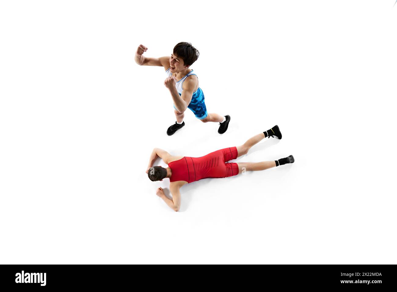 Top view. Two male wrestling athletes in blue and red uniform, showing ...