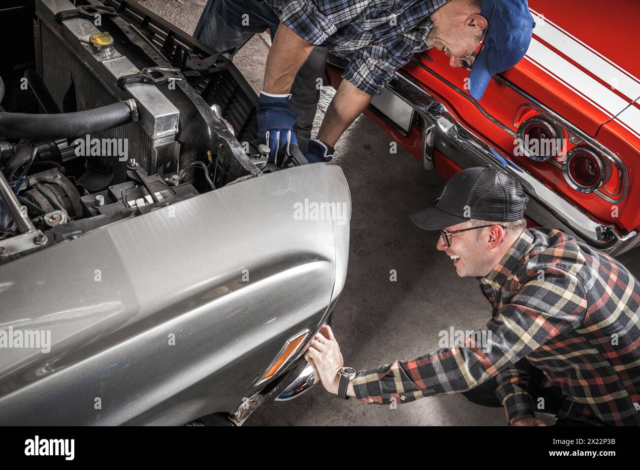 Two Caucasian Classic Cars Enthusiasts Enjoying American Muscle Cars Collection Stock Photo