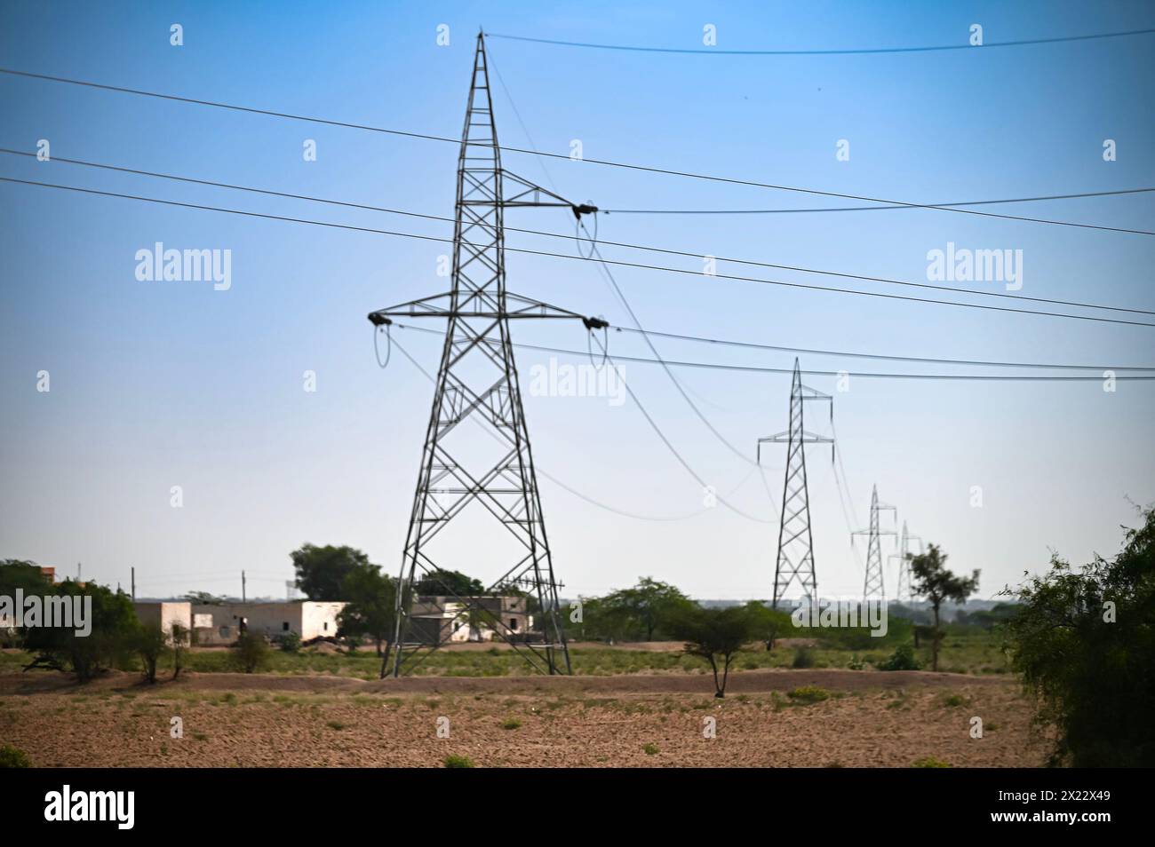 High voltage electricity transmission lines at Thar desert, Rajasthan, India. Stock Photo