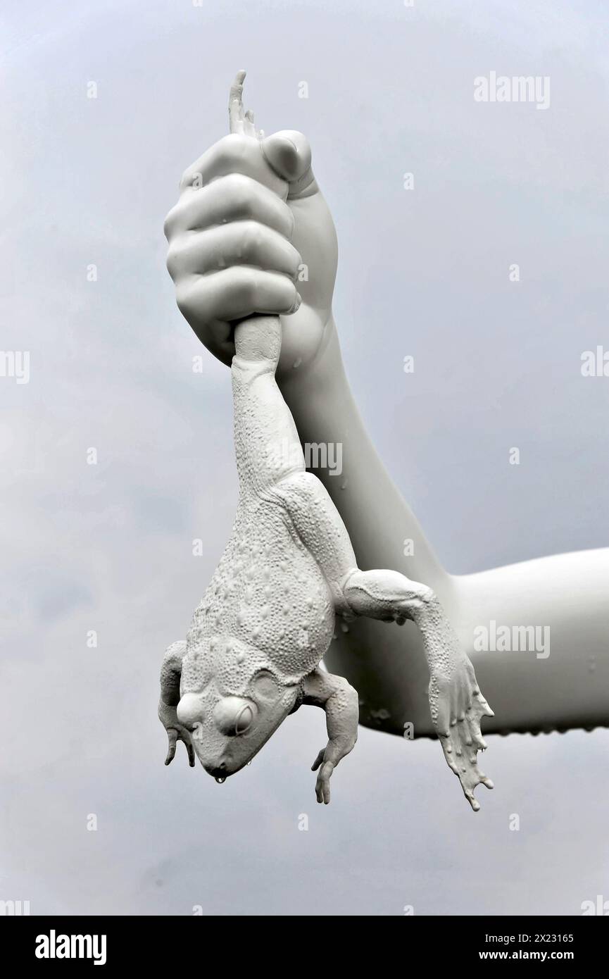Charles Ray's statue of the boy with a frog on the top of the Zattere, detail of a surrealist sculpture with a white hand holding a frog, Venice Stock Photo