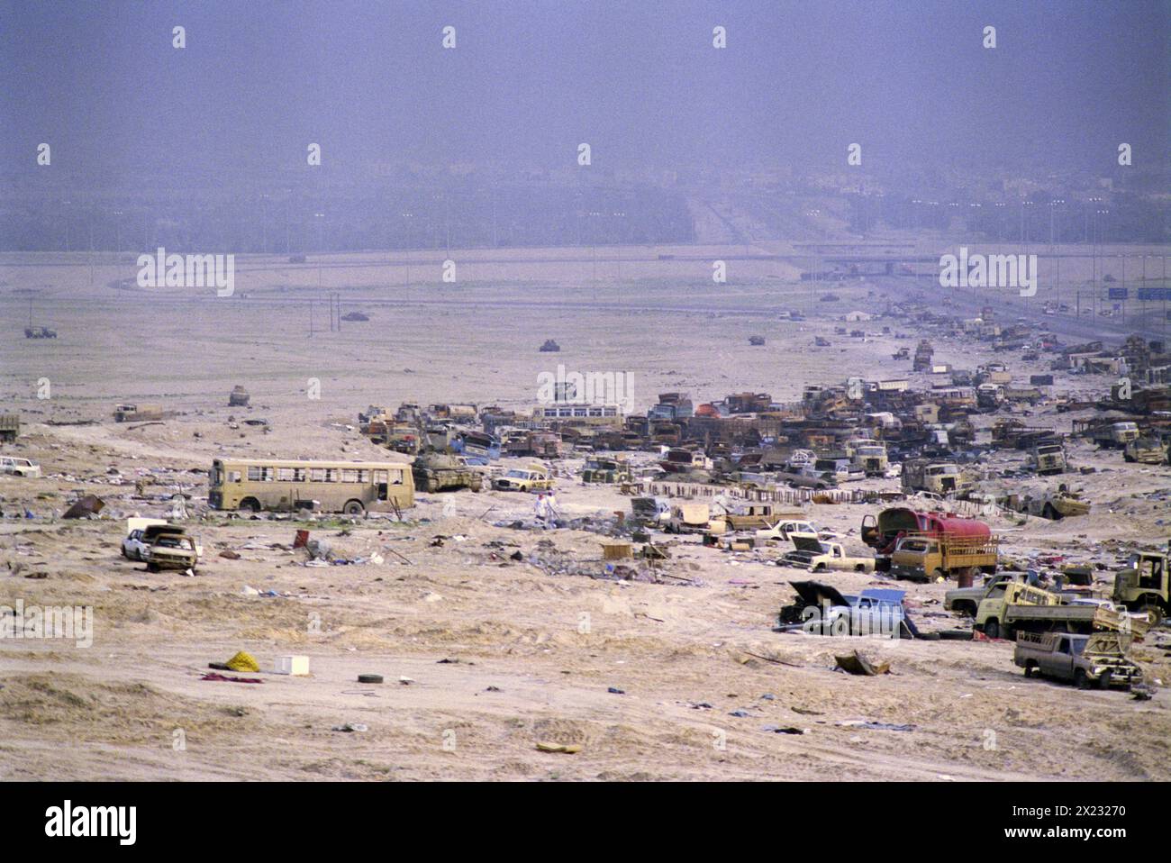 First Gulf War: 1st April 1991 Wrecked Iraqi Army vehicles along the “Highway of Death” on the road to Basra, west of Kuwait City. Stock Photo