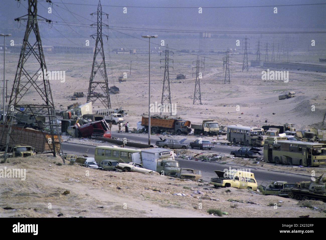 1st April 1991 Wrecked Iraqi Army vehicles along the “Highway of Death” on the road to Basra, west of Kuwait City. Stock Photo
