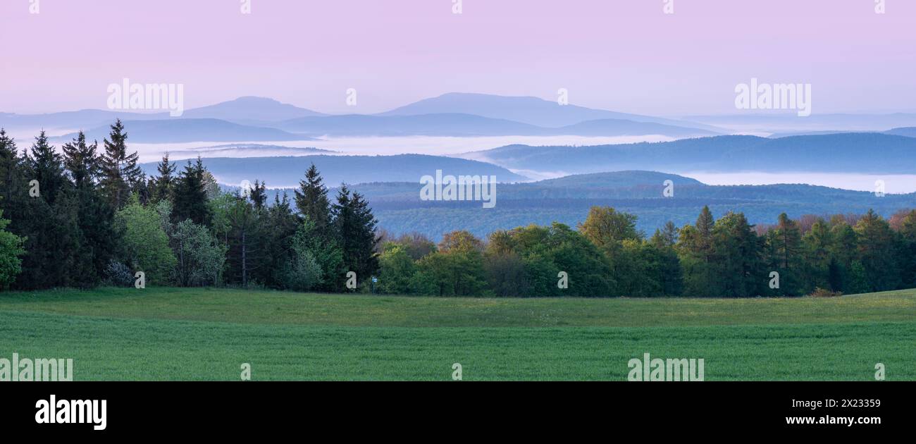 Panorama, view over endless chains of hills and forests at Gebaberg at dawn, fog in the valleys, Hohe Geba, Vordere Rhoen, Meiningen, Rhoen Stock Photo
