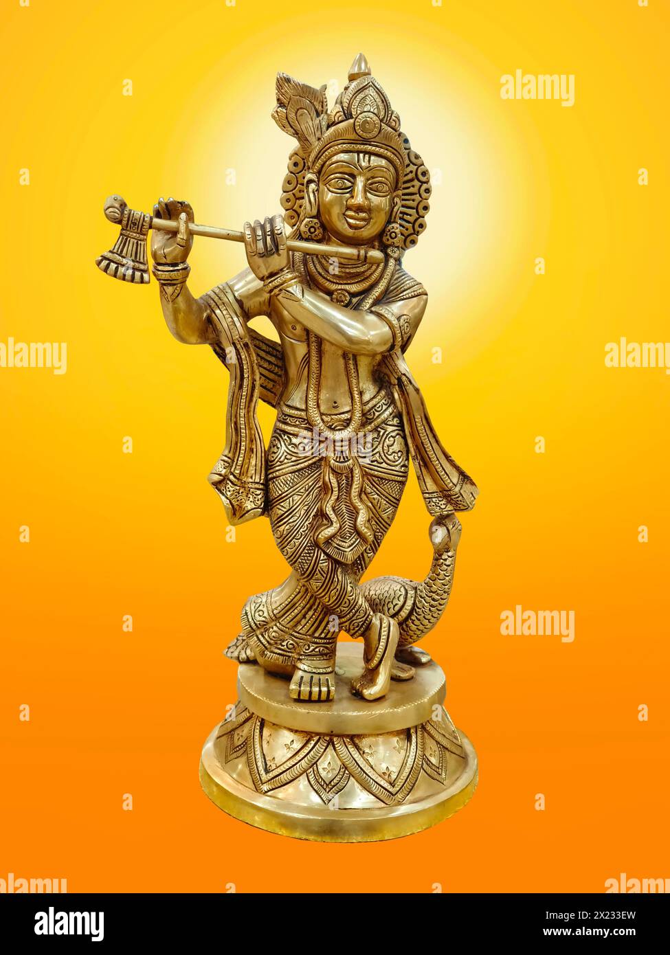 Krishna god Vishnu avatar brass statue isolated on background. Stock Photo