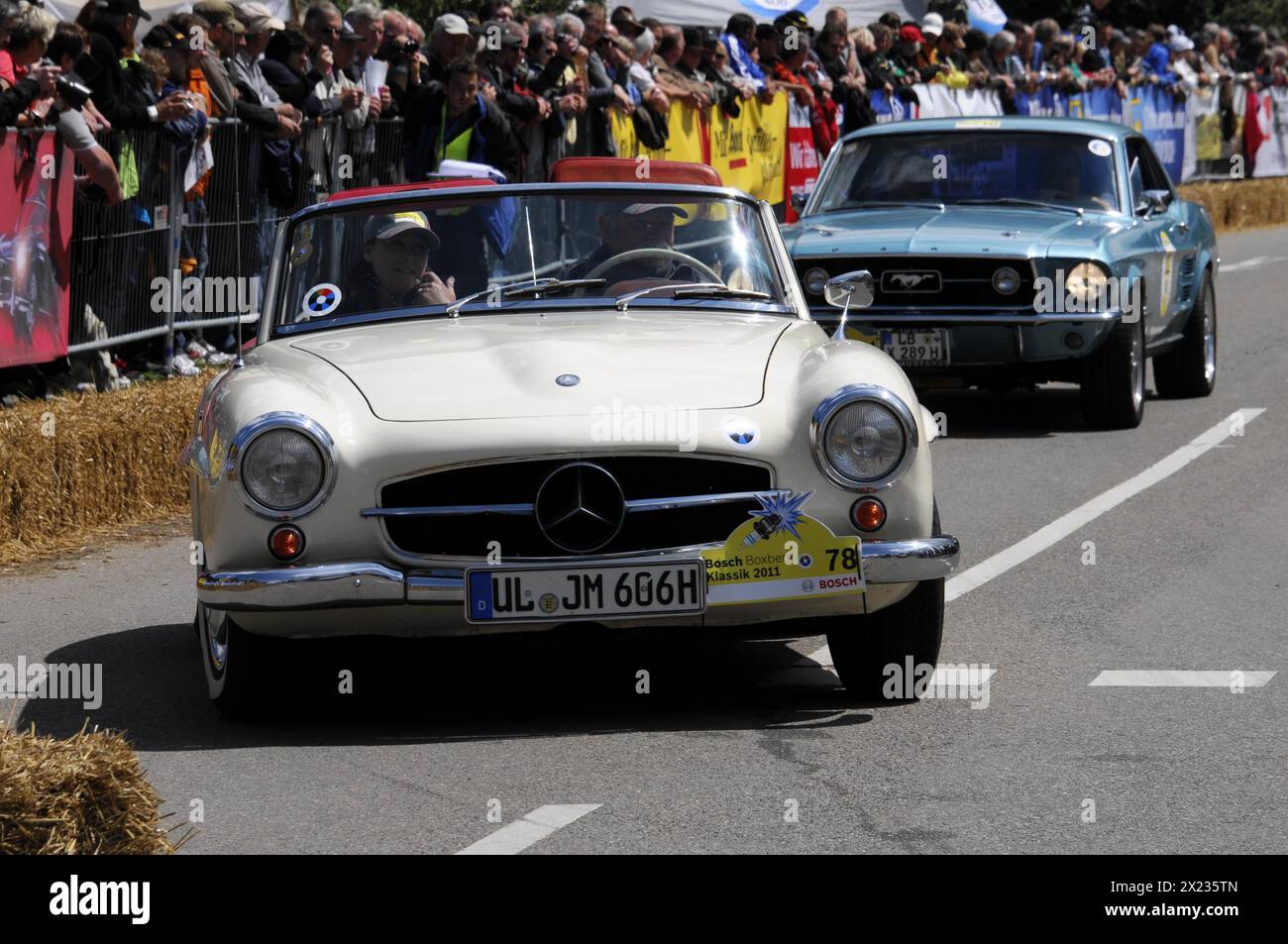 A white Mercedes-Benz vintage cabriolet drives in front of spectators at a road race, SOLITUDE REVIVAL 2011, Stuttgart, Baden-Wuerttemberg, Germany Stock Photo