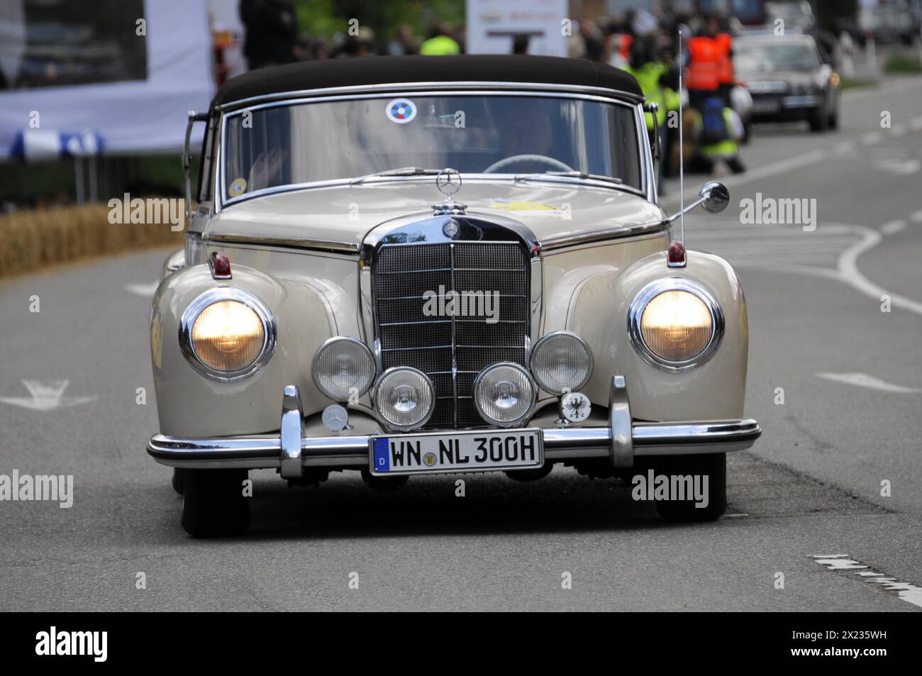 A white Mercedes-Benz classic car drives on a road during a rally, SOLITUDE REVIVAL 2011, Stuttgart, Baden-Wuerttemberg, Germany Stock Photo
