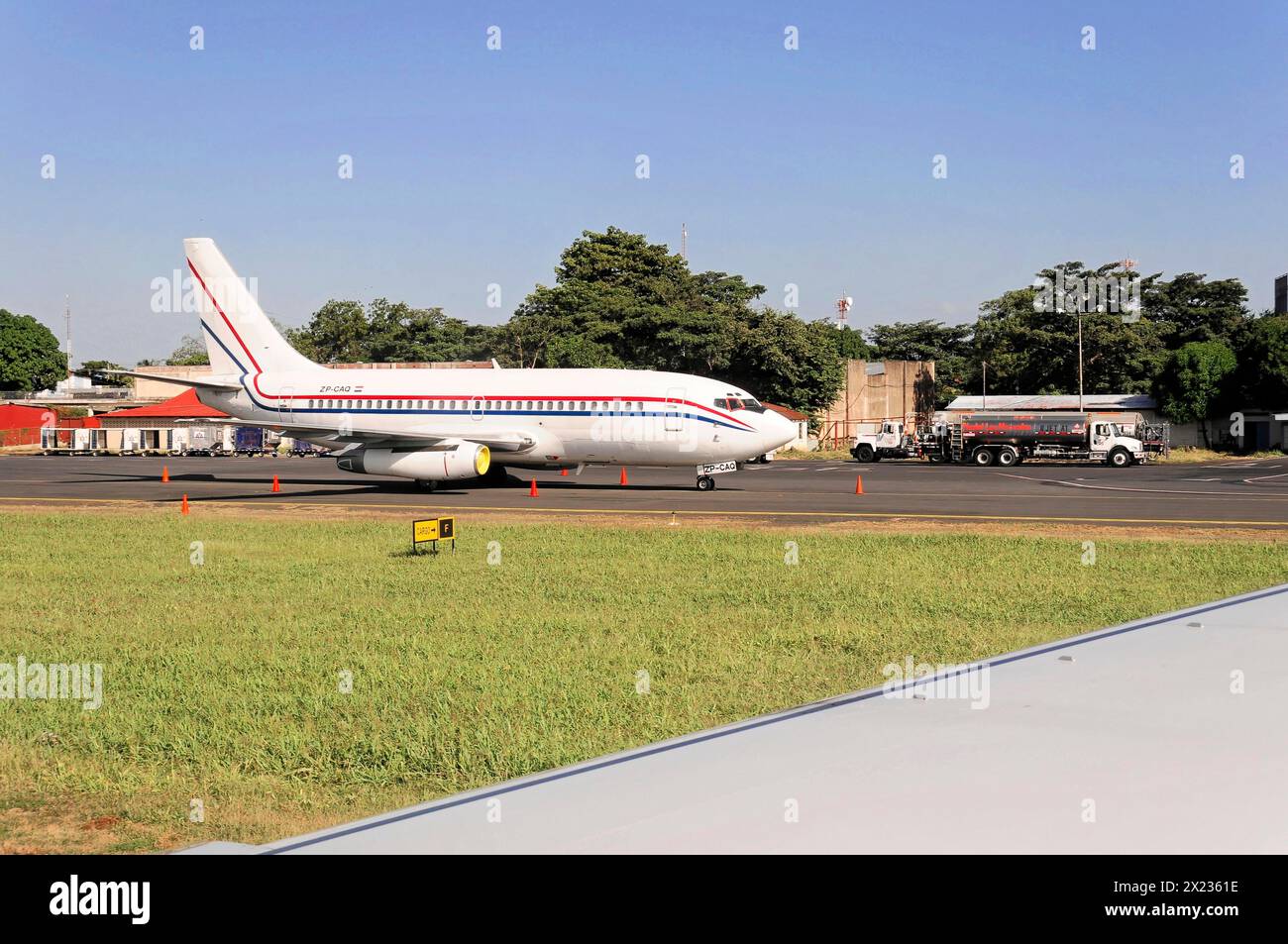 AUGUSTO C. SANDINO Airport, Managua, Somewhat outdated aeroplane on a tarmac in front of airport buildings, Nicaragua, Central America, Central Stock Photo
