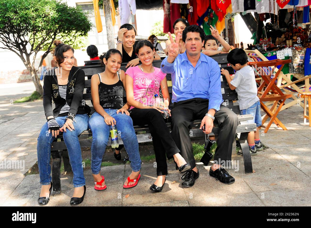 Leon, Nicaragua, Group of people of different ages sitting on a bench