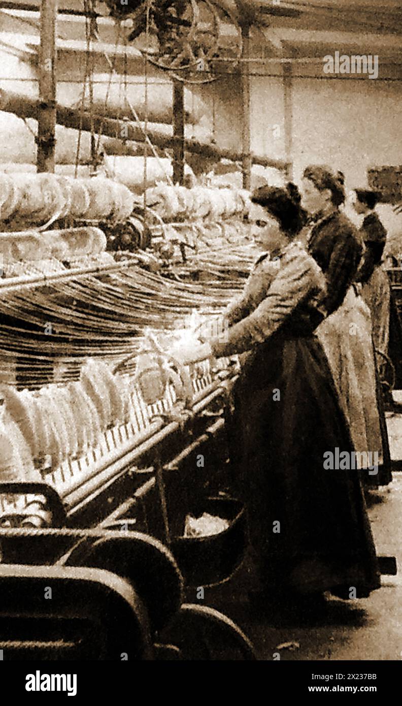 Victorian women working with spinning looms c1900 Stock Photo