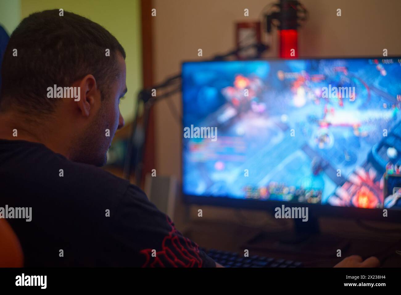 gamer man playing league of legends Stock Photo