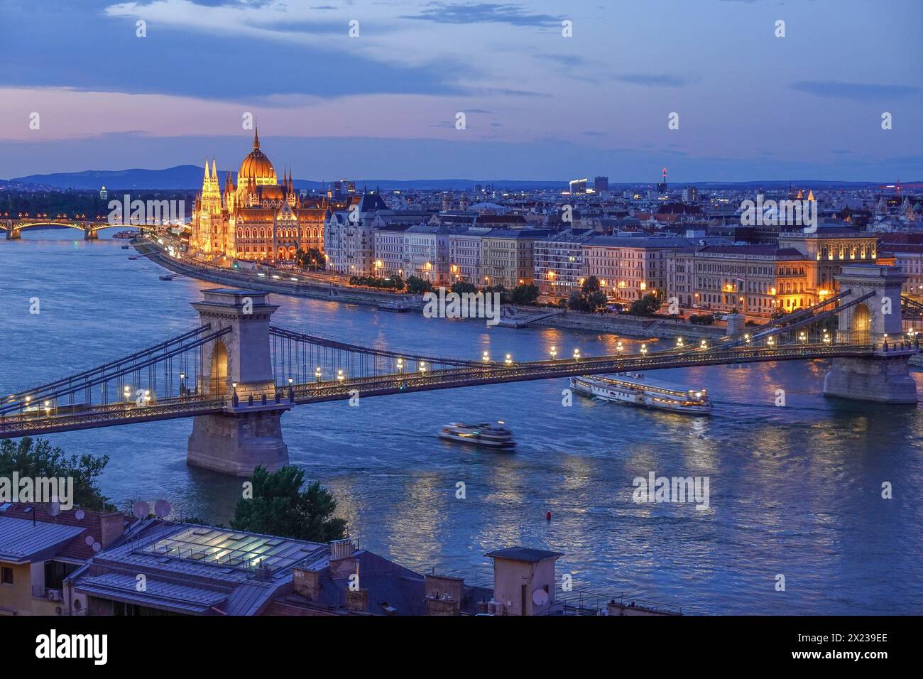 Hungary, Budapest, Aerial cityscape image of Budapest with the illuminated Szechenyi Chain Bridge and parliament building. Designed by English enginee Stock Photo