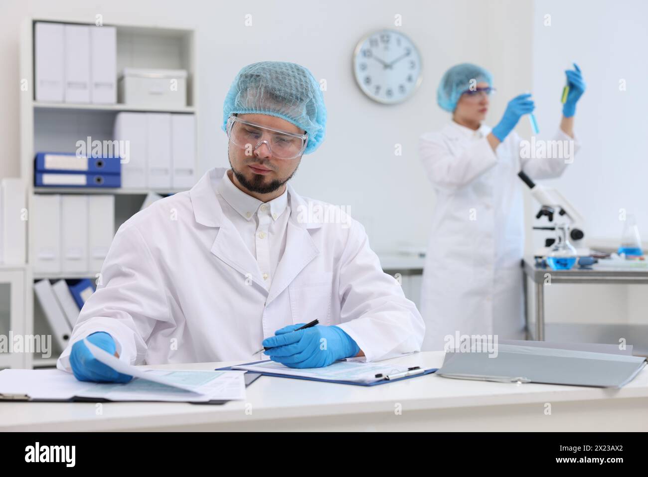 Quality control. Food inspectors checking safety of products in ...