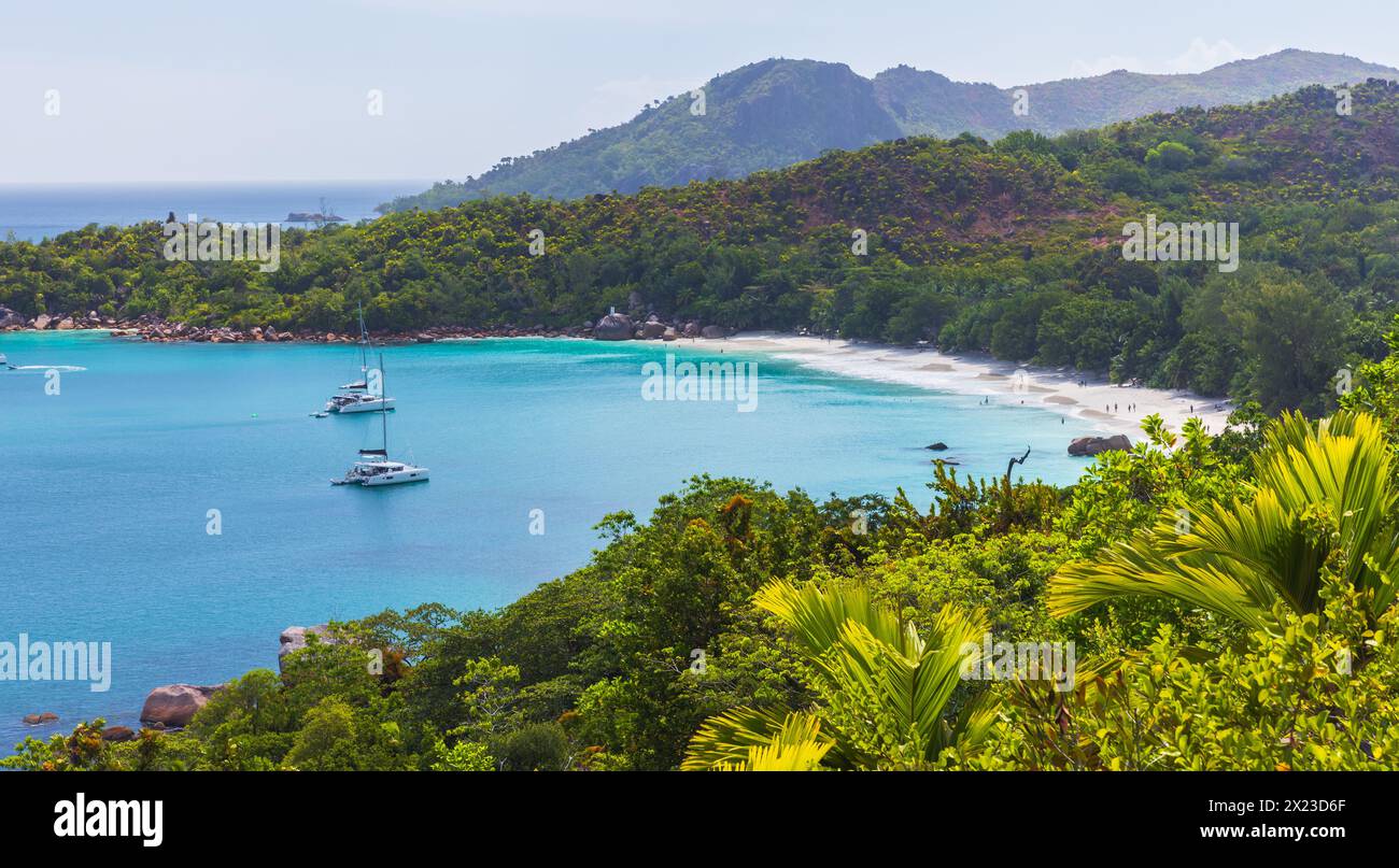 Panoramic photo of Anse Lazio beach on a sunny day. Praslin island coastal landscape, Seychelles Stock Photo