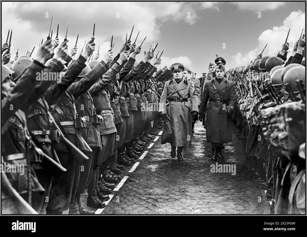 Benito Mussolini Il Duce inspects the Italian Fascist Militia on the occasion of their 19th anniversary. The 19th day of the Fascist Militia was the first day of February 1942 in Rome, with its debut as a solemn tribute to the fallen Blackshirts in Italy. Rome Italy Stock Photo