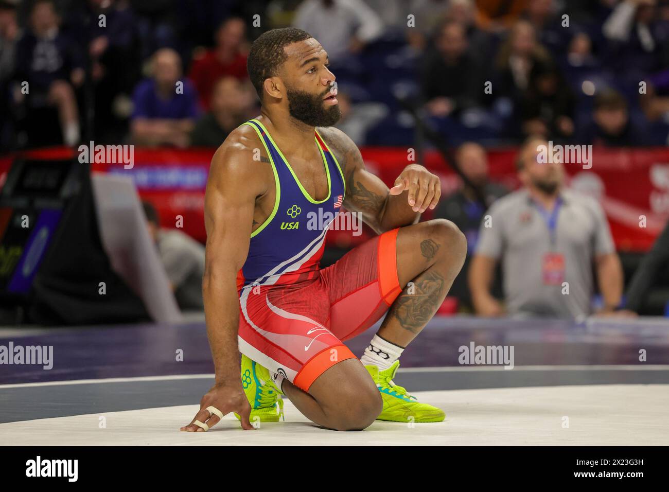 State College, Pennsylvania, USA. 19th Apr, 2024. 2012 Olympic Gold Medalist JORDAN BURROUGHS (red singlet) awaits the ruling of a challenge during his second round match in the 74KG weight class of the Challenge Tournament held at the Bryce Jordan Center on the campus of Penn State University. (Credit Image: © Scott Rausenberger/ZUMA Press Wire) EDITORIAL USAGE ONLY! Not for Commercial USAGE! Stock Photo