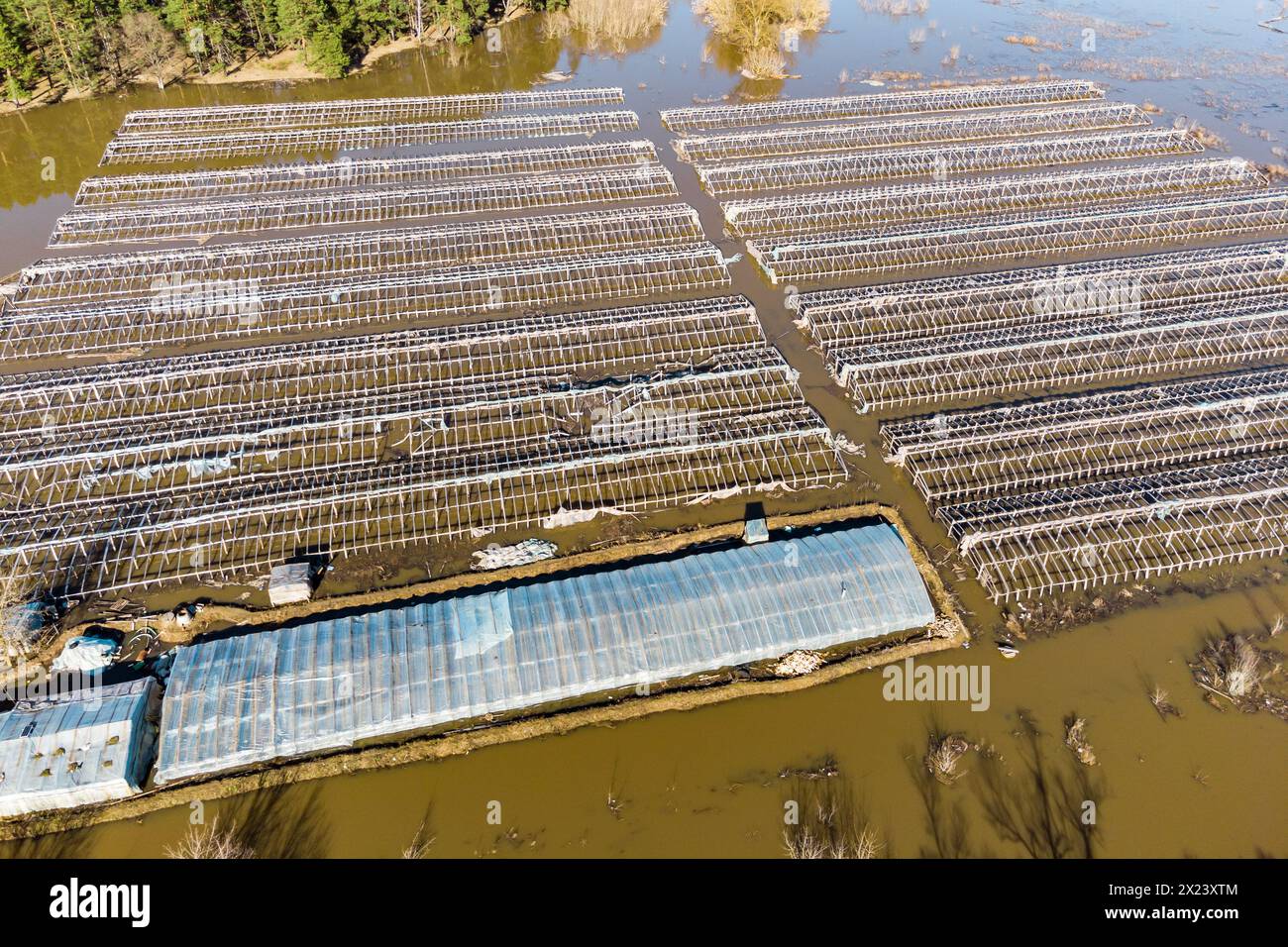 Agricultural farm fields with greenhouses flooded during a strong ...