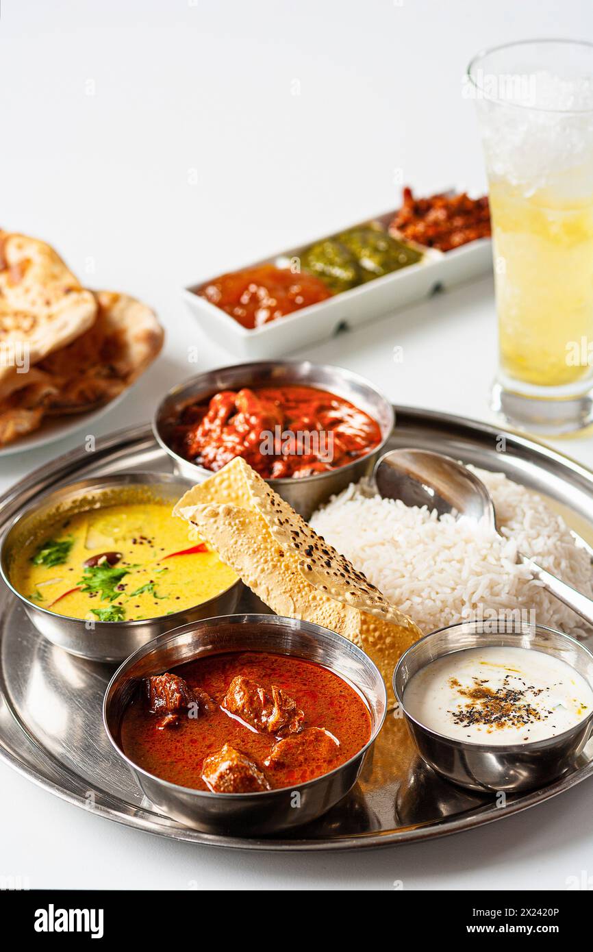 Three Indian curry dishes: coconut fish curry, beef vindaloo and tandoori chicken Stock Photo