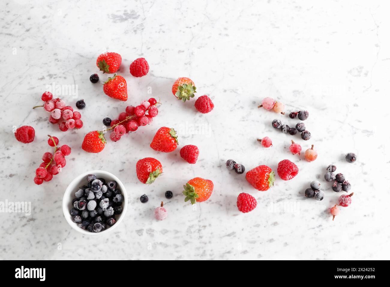 Fresh and frozen berries Stock Photo