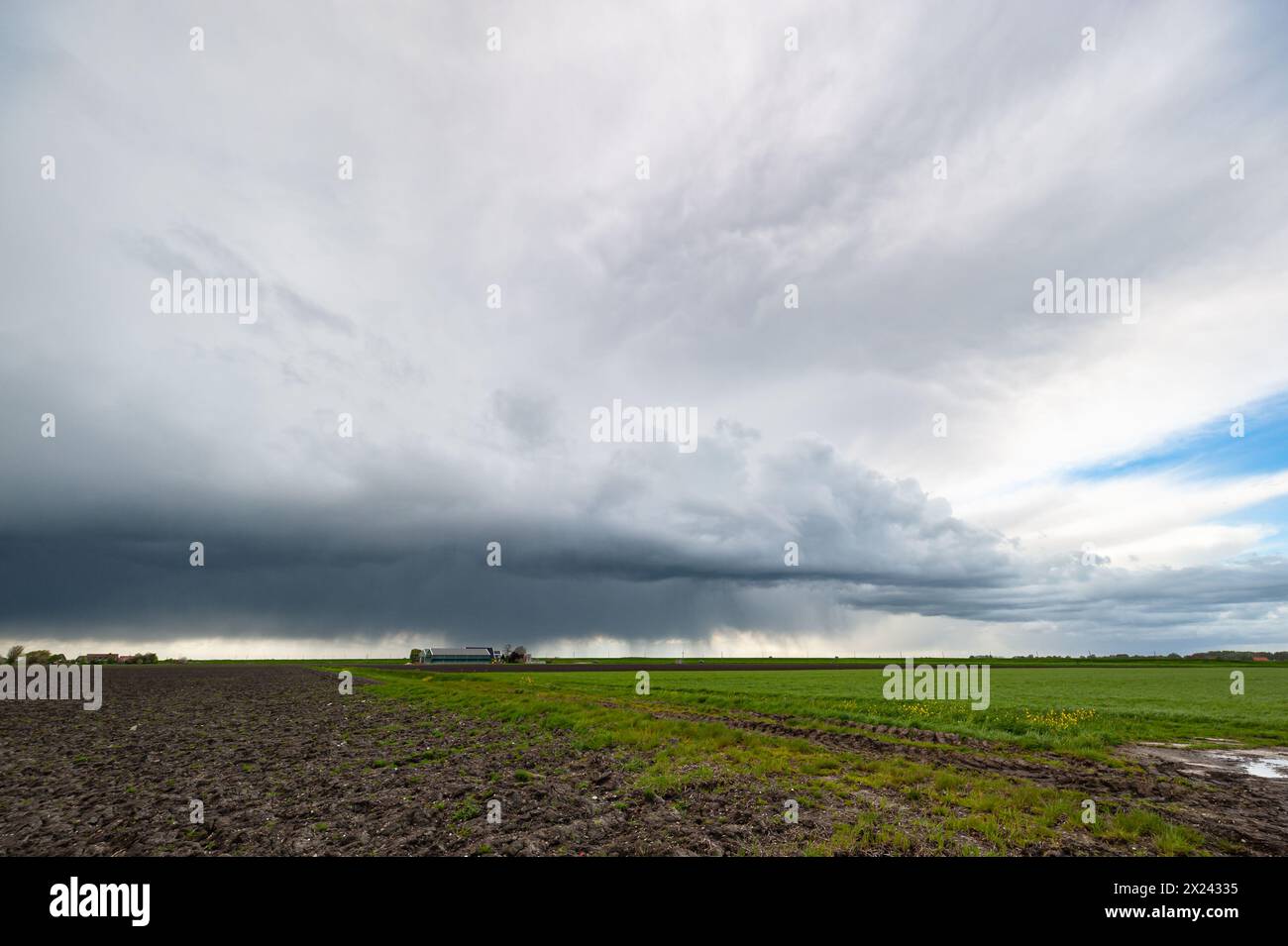 Storm cloud over plain farmland, Great Plains, USA. Stock Photo