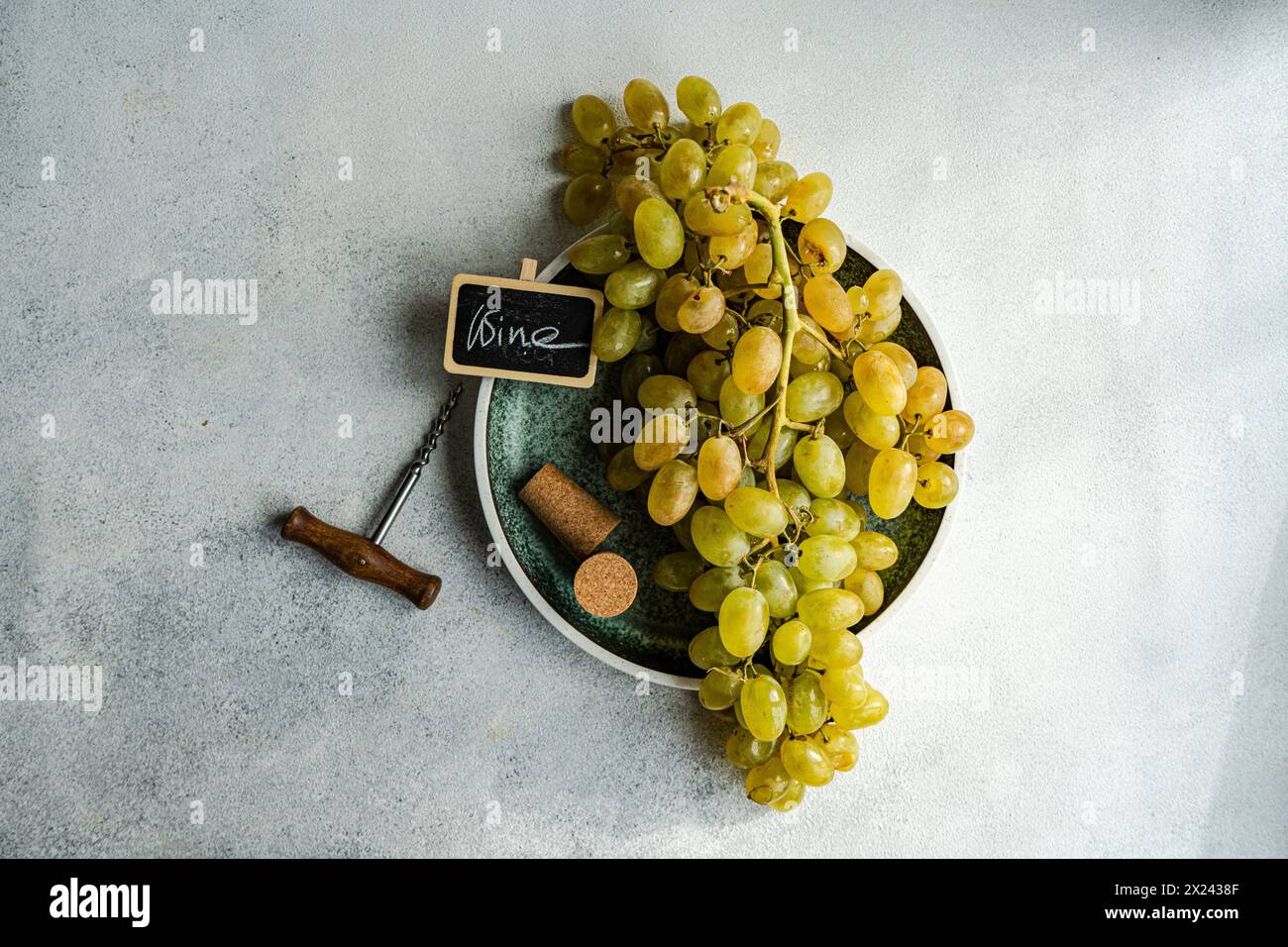 Ripe grapes on the vine on a plate Stock Photo