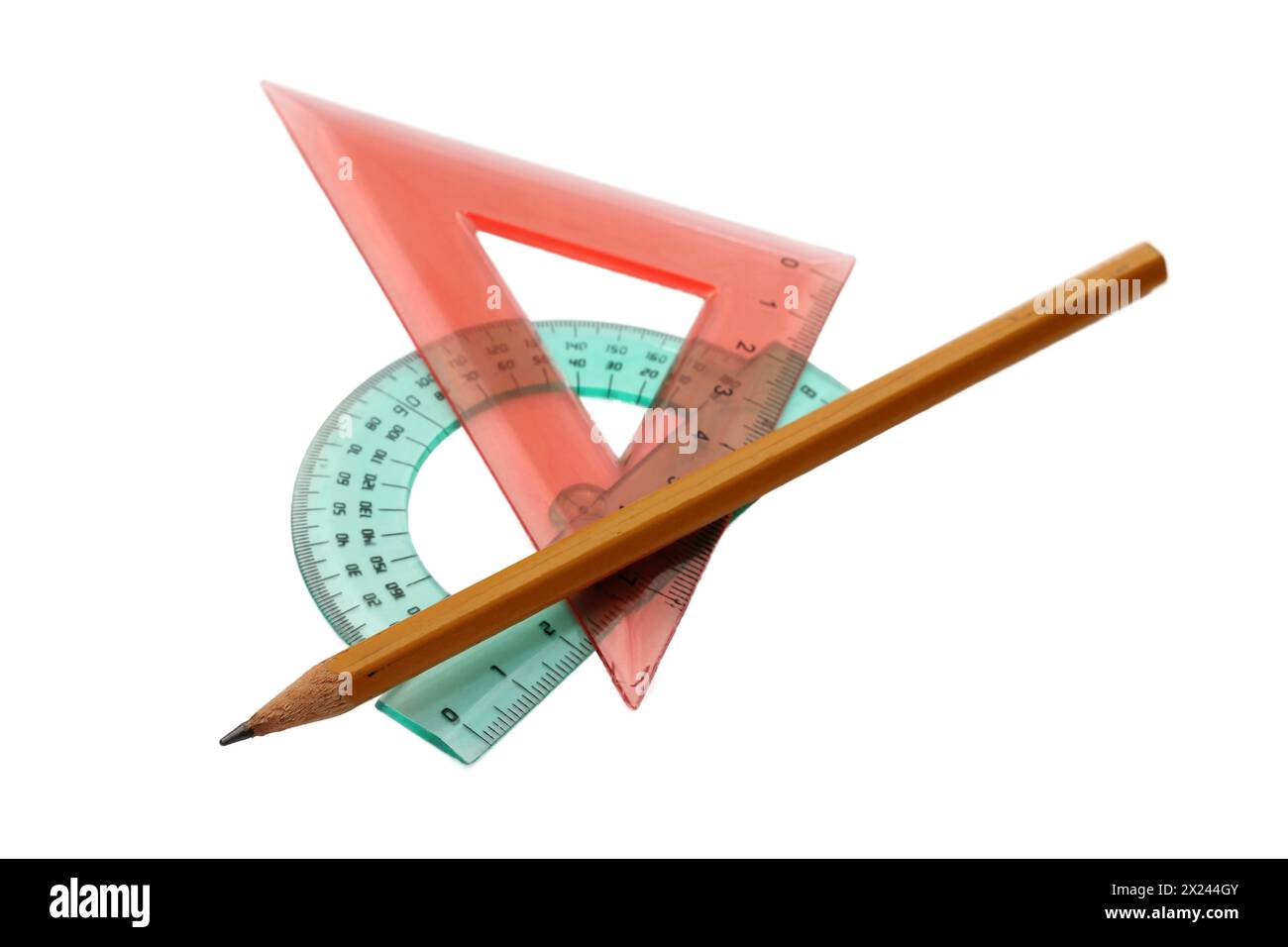 Plastic ruler and pencil on white background Stock Photo - Alamy