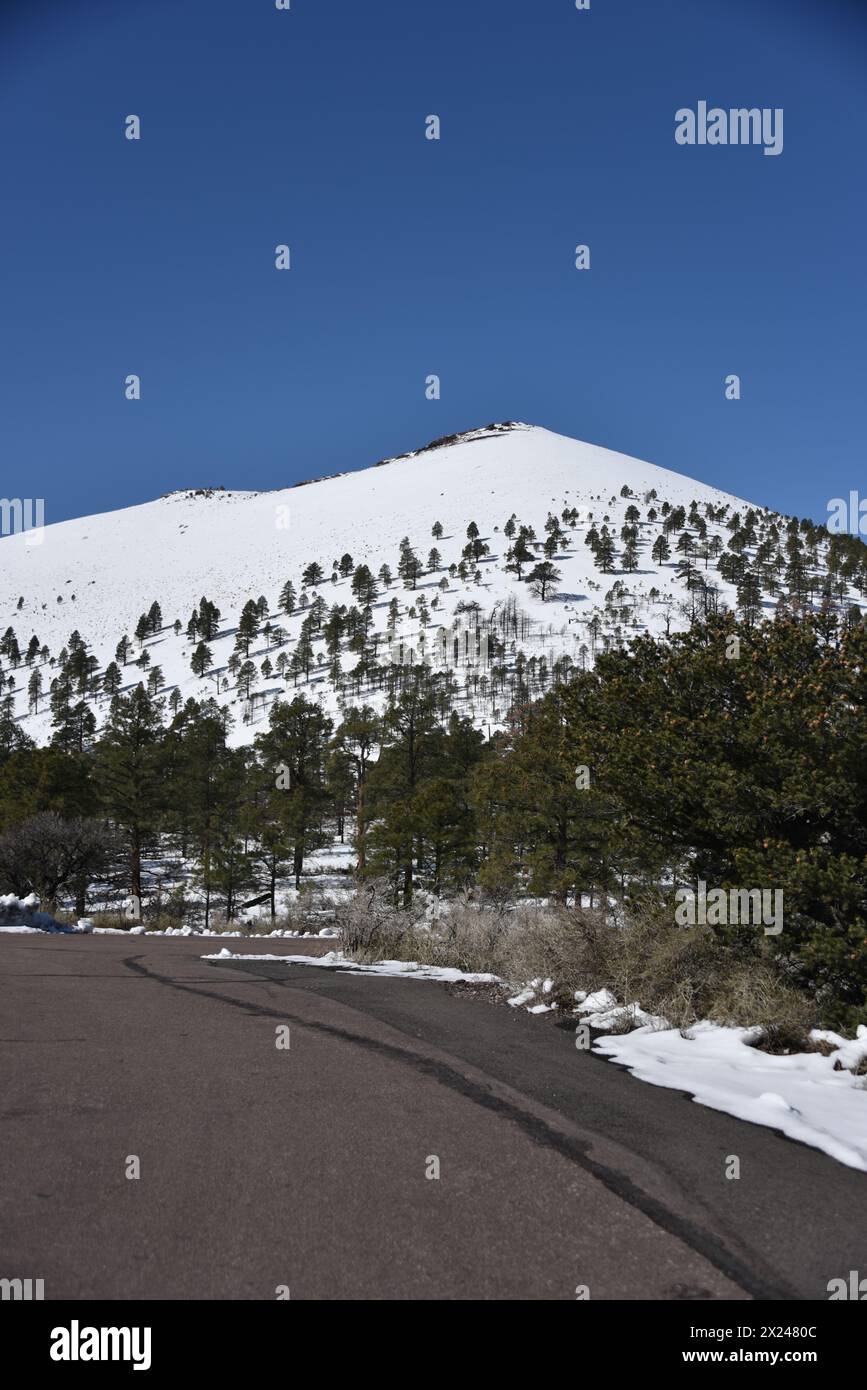 Flagstaff, AZ. U.S.A. 3/20/2024. Sunset Crater Volcano National Monument. This 1,120 ft high cinder cone erupted around A.D. 1085 leaving lava Stock Photo