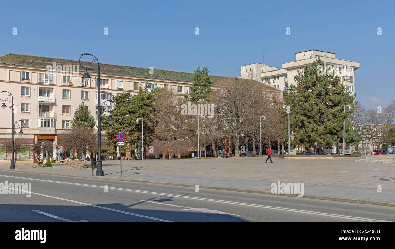 Craiova, Romania - March 16, 2024: William Shakespeare Square View From Alexandru Ioan Cuza Street at Sunny Spring Day.. Stock Photo