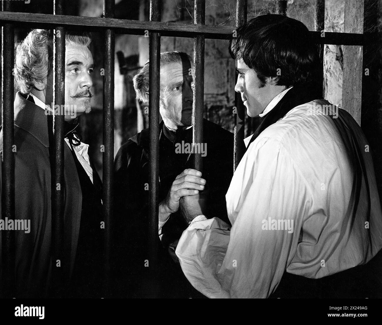 Clifford Evans, John Gabriel, Oliver Reed, on-set of the film, 'The Curse Of The Werewolf', Universal Pictures, 1961 Stock Photo