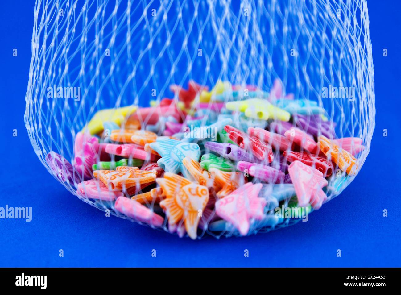 Net with colorful captured fish Stock Photo - Alamy