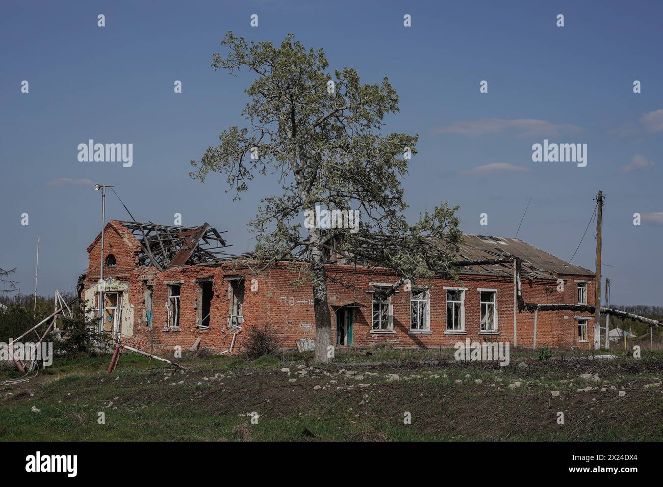 Yevhen Vasyliev/Le Pictorium - HRAKOVE, KHARKIV REGION - 12/04/2024 - Ukraine/kharkiv oblast/Hrakove - From February 25 to September 7, 2022, the village was occupied by the Russian army until it was liberated by the Ukrainian Armed Forces. The village was heavily damaged as it was on the front line under constant shelling for 195 days, and the consequences are still visible 19 months after de-occupation. The school, the village council building, the church, shops, private and apartment buildings - everything was destroyed. A torture chamber was set up in one of the basements of an Stock Photo