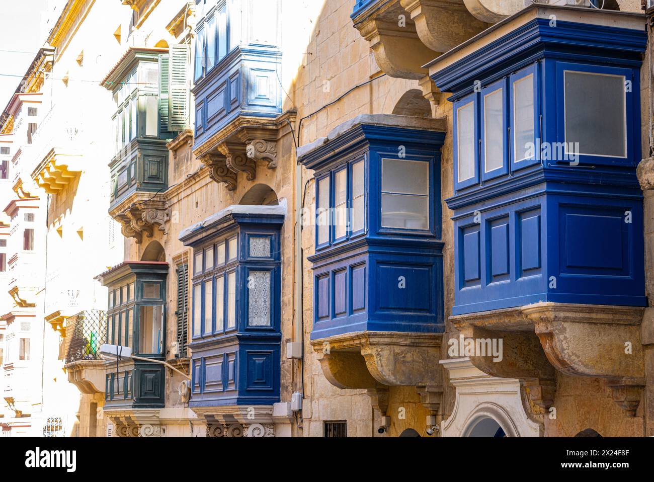 Valletta, Malta, April 03, 2024. view of the typical wooden balconies in the old buildings in the city center Stock Photo