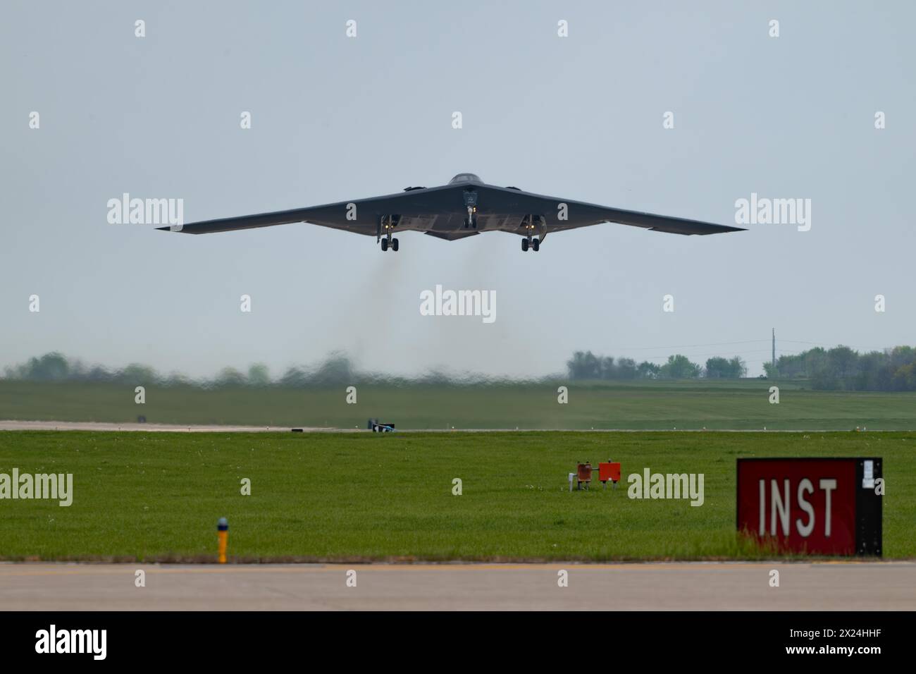 A B-2 Spirit stealth bomber assigned to the 509th Bomb Wing takes off at Whiteman Air Force Base, Mo., April 15, 2024. Team Whiteman executed a mass fly-over of 12 B-2 Spirit stealth bombers to cap off the annual Spirit Vigilance exercise. Routine training ensures that Airmen are always ready to execute global strike operations… anytime, anywhere.. (U.S. Air Force photo by Airman 1st Class Matthew S. Domingos) Stock Photo