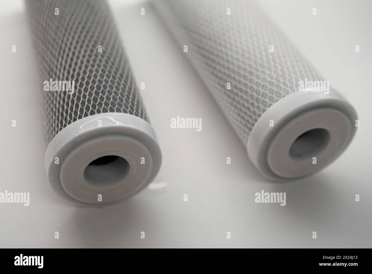 Replacing the carbon filter in the reverse osmosis system on the table.  Stock Photo