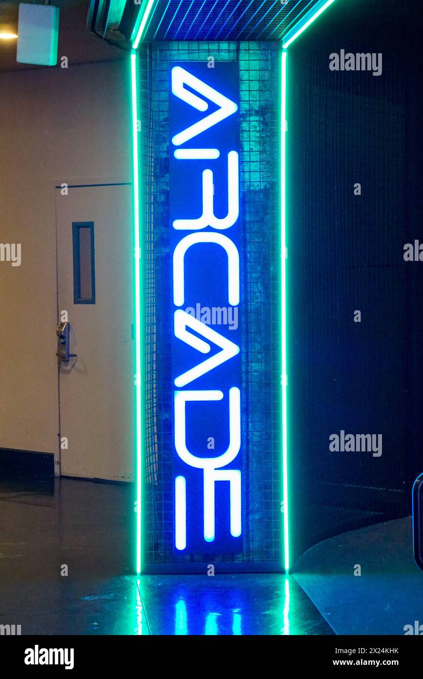 A very cool looking, retro, blue and green neon arcade sign at the ...