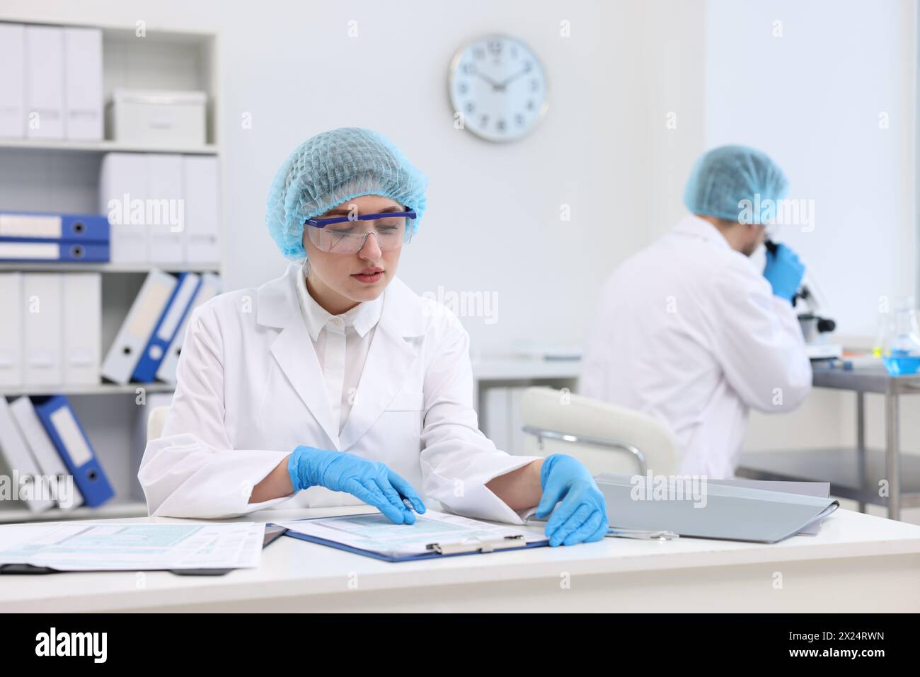 Quality control. Food inspectors checking safety of products in ...