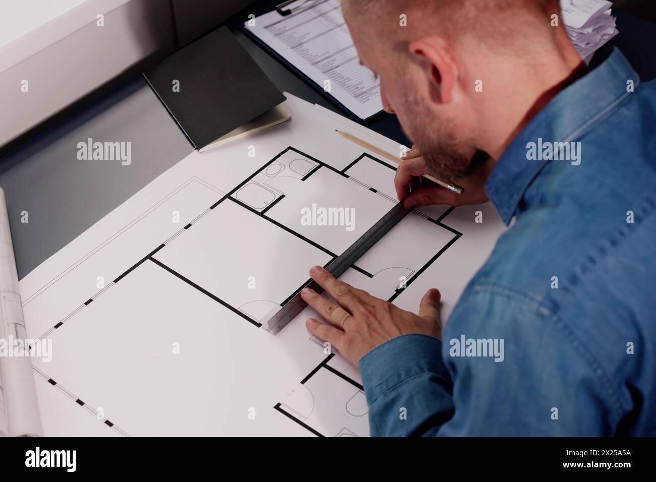 Architect Engineer Drawing Architectural Construction Plan In Office Stock Photo