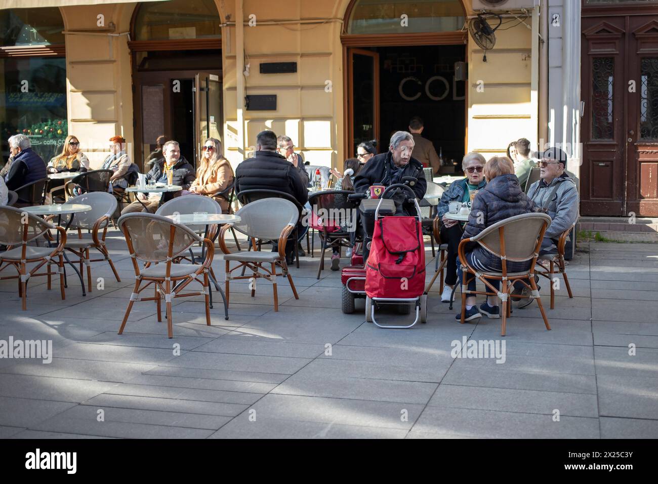 Belgrade, Serbia, Feb 17, 2024: A view of an outdoor cafe bustling with guests in Zemun Stock Photo