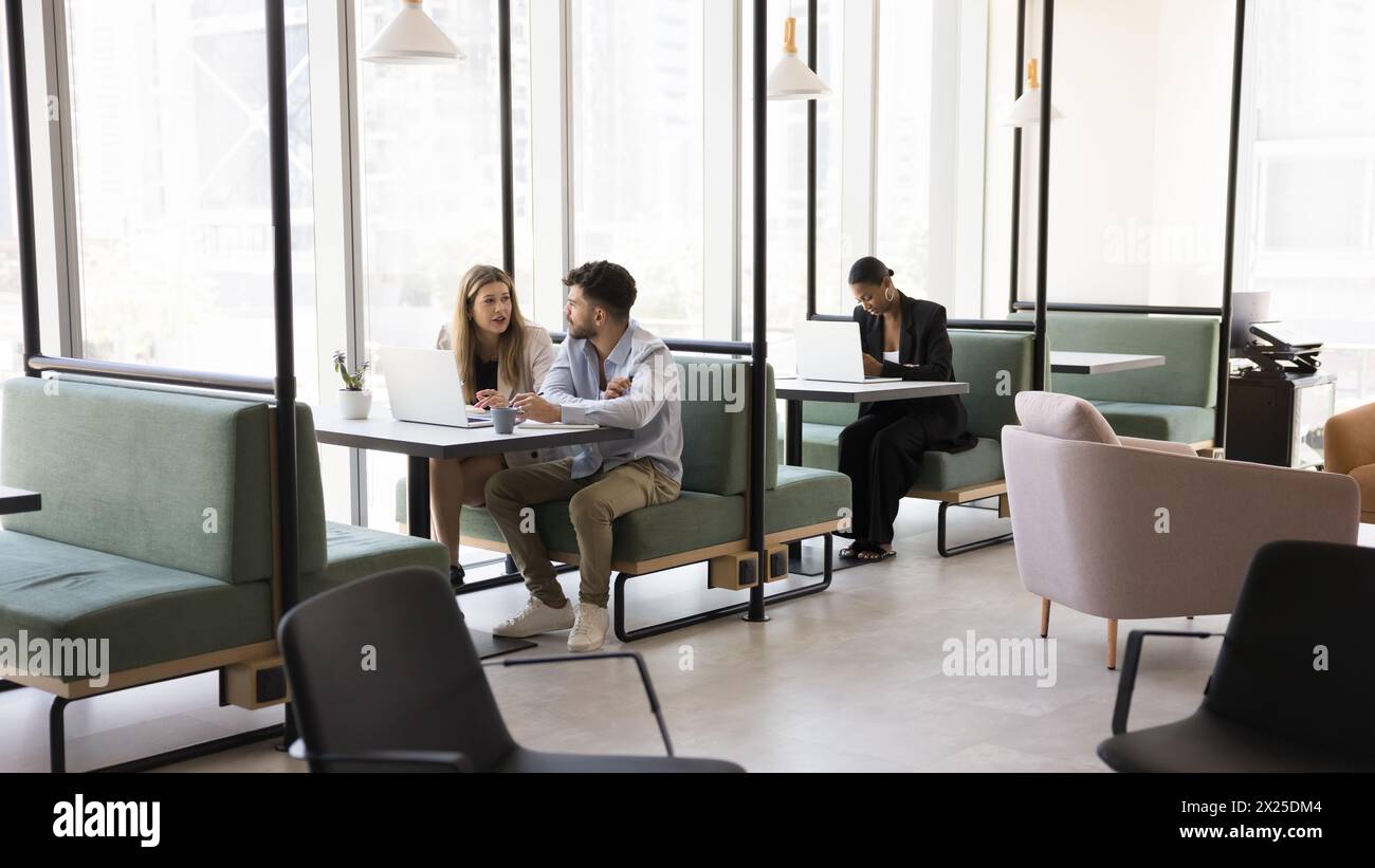 Diverse freelance project managers working at computers Stock Photo