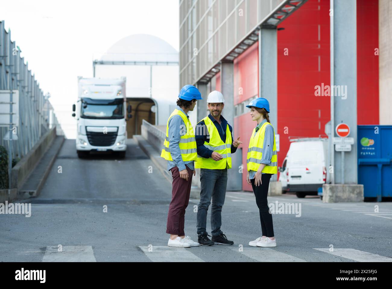 three construction engineers working outdoors Stock Photo