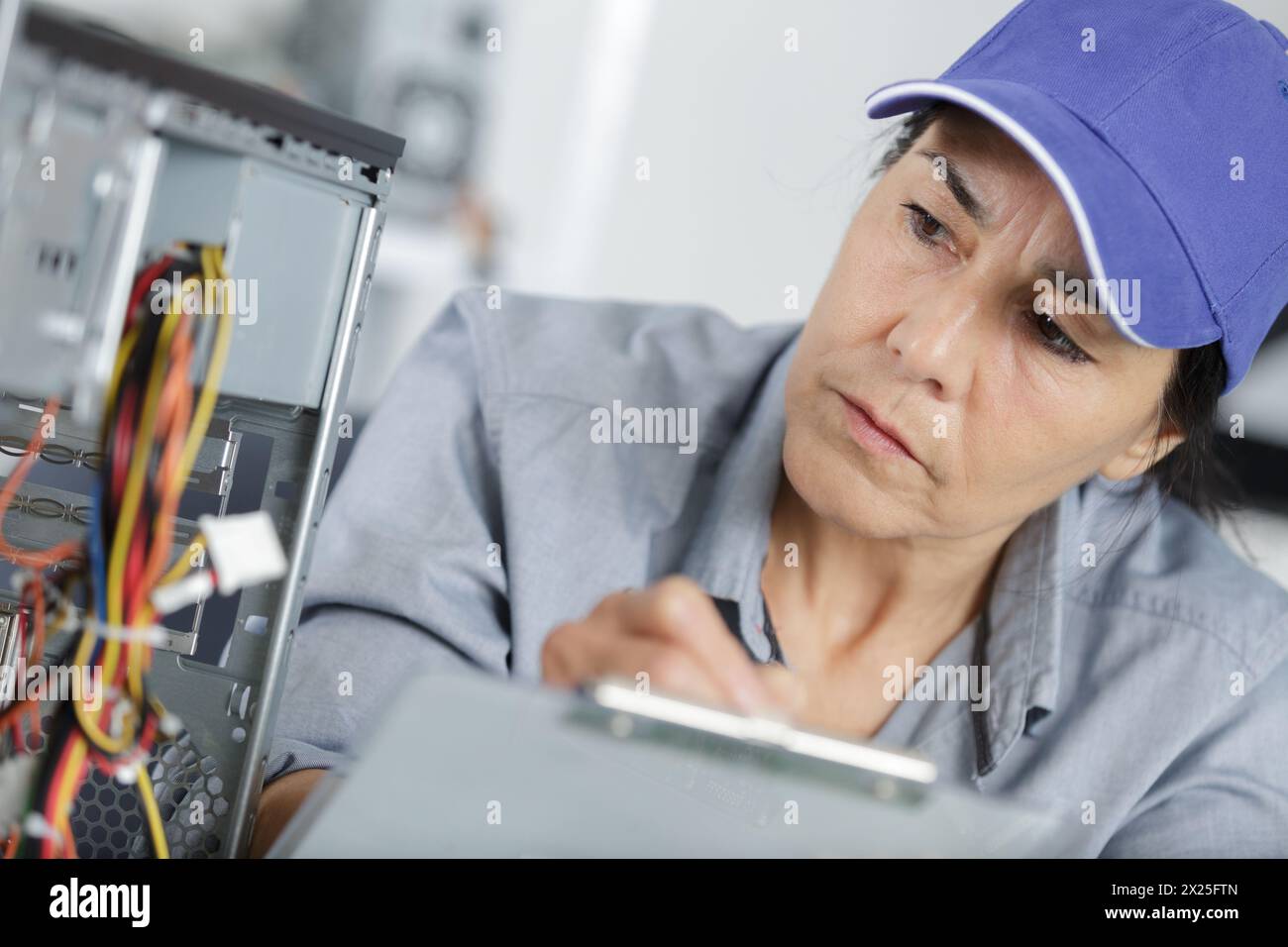 it woman checking a broken pc Stock Photo