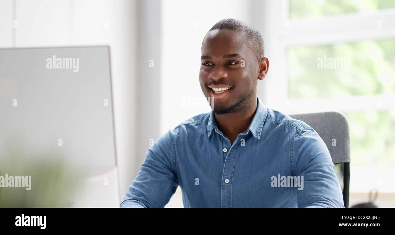 African American man using computer for business communication. Stock Photo