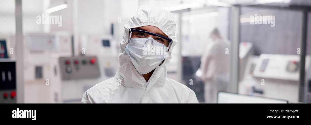 Woman engineer using tablet in medical engineering factory Stock Photo