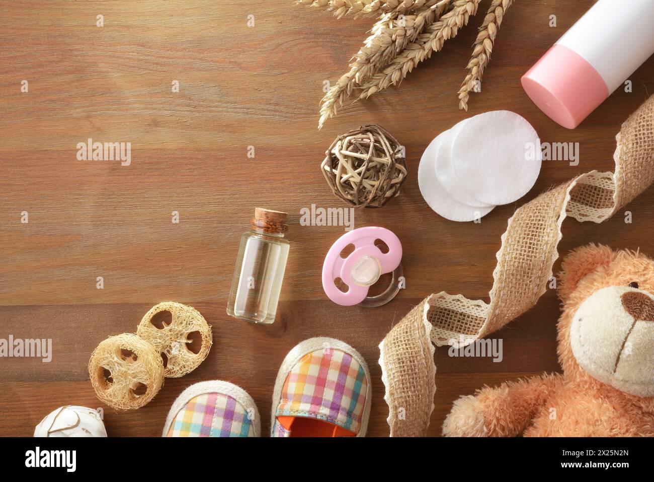 Background with baby grooming accessories and decoration on wooden table.. Top view. Stock Photo